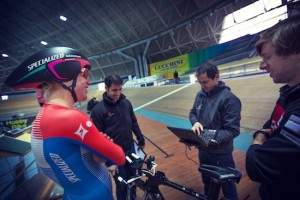 Specialized athlete Ellen Van Dijk and her team examine her position at a velodrome. On-track and on-road testing will also continue to be an important part of the development process.