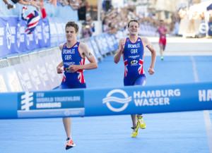 Jonathan Brownlee (left) wins the elite men's ITU 2013 World Triathlon Series race ahead of his brother Alistair Brownlee in Hamburg, Germany