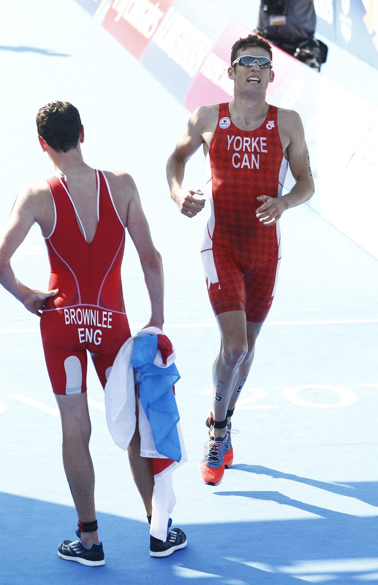 Andrew Yorke finishes  at the elite men's 2014 Commonwealth Games triathlon in Strathclyde Country Park in in Glasgow, Scotland (Credit: Nigel Farrow )