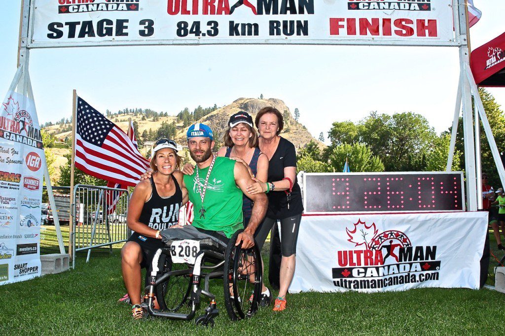 Andre Kajlich, CAF athlete at the finish line of Day 3 double marathon with mom and crew. Credit: Rick Kent