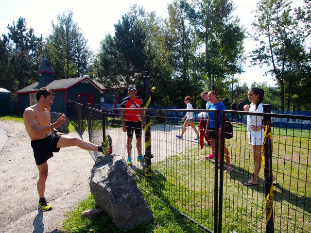 Javier Gomez, the current ITU world Champion, is one of the biggest draws at the event. Here he chats with some fans while he stretches after a run workout.