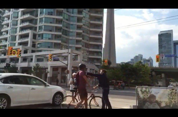 In a video published by Metro News, a pedestrian is seen punching a cyclist during an altercation on the Queen’s Quay bike lane.