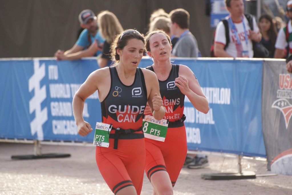 Sasha Boulton guides Christine Robbins to an eighth place finish in today's Paratriathlon World Championship.