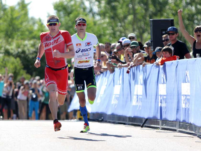 Pro men Andy Potts and Ben Hoffman neck in neck at the finish line at last year's Ironman 70.3 Calgary